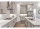 Modern kitchen featuring light grey cabinets and white countertops and stainless steel appliances at 134 Everley Walk, Alpharetta, GA 30009