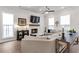 Bright living room featuring a fireplace, large windows, and comfortable seating at 134 Everley Walk, Alpharetta, GA 30009