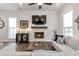 Living room with a fireplace, large windows, and hardwood floors at 134 Everley Walk, Alpharetta, GA 30009