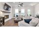 Comfortable living room with a fireplace, TV, and neutral decor at 134 Everley Walk, Alpharetta, GA 30009