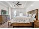 Spacious bedroom with tray ceilings, shiplap accent wall, and access to a balcony at 134 Everley Walk, Alpharetta, GA 30009