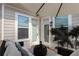 Charming covered patio with comfortable seating and views of the surrounding community at 134 Everley Walk, Alpharetta, GA 30009