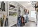 Well-organized walk-in closet with ample shelving, drawers, and hanging space at 134 Everley Walk, Alpharetta, GA 30009