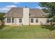 Home exterior features a large backyard and screened-in patio area at 1698 Bennett Dr, Mcdonough, GA 30253