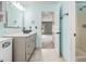 Stylishly renovated bathroom featuring modern fixtures, marble counters, and walk-in shower at 1698 Bennett Dr, Mcdonough, GA 30253
