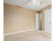 Bedroom featuring a ceiling fan, plush carpet, and a open entry way to the next room at 1698 Bennett Dr, Mcdonough, GA 30253