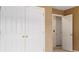Double doors lead into this closet with an open door leading to another room at 1698 Bennett Dr, Mcdonough, GA 30253