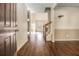 Inviting foyer with hardwood floors, neutral walls, and staircase leading to the upper level, providing a warm welcome at 1698 Bennett Dr, Mcdonough, GA 30253