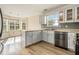 Bright kitchen with light-colored cabinets, stainless steel appliances, and a sunny breakfast nook with bay windows at 1698 Bennett Dr, Mcdonough, GA 30253