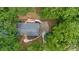 Aerial view of home showcasing backyard, deck, and mature tree coverage at 3713 Brigantine Ct, Acworth, GA 30102