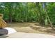 Inviting backyard space featuring a concrete patio and lush green surroundings at 3713 Brigantine Ct, Acworth, GA 30102