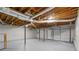 Unfinished basement with exposed ductwork, ready for customization with a garage entrance, bright and open space at 3713 Brigantine Ct, Acworth, GA 30102