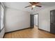 Inviting bedroom with neutral walls, hardwood floors, and a contemporary ceiling fan at 3713 Brigantine Ct, Acworth, GA 30102