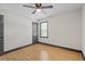 Cozy bedroom with natural light, ceiling fan, and sleek flooring at 3713 Brigantine Ct, Acworth, GA 30102