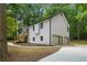 Well-maintained two-story home with an attached two car garage surrounded by lush greenery at 3713 Brigantine Ct, Acworth, GA 30102