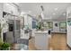 Bright and airy kitchen with stainless steel appliances, white cabinets, and hardwood floors at 3713 Brigantine Ct, Acworth, GA 30102