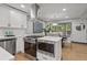 Modern kitchen with stainless steel appliances, gas range, island, and eat-in dining at 3713 Brigantine Ct, Acworth, GA 30102