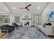 Comfortable living room with a modern fireplace, stylish furniture, and hardwood floors at 3713 Brigantine Ct, Acworth, GA 30102