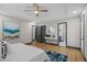 Main bedroom with hardwood floors, stylish decor, and ensuite bathroom access at 3713 Brigantine Ct, Acworth, GA 30102