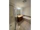 Clean bathroom featuring a shower, soaking tub, vanity with cabinets, and tile floor at 57 Forsyth Nw St # 11B, Atlanta, GA 30303