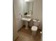 Small bathroom featuring pedestal sink, toilet, tile flooring, and classic fixtures at 57 Forsyth Nw St # 11B, Atlanta, GA 30303