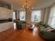 Inviting living room with hardwood floors, two sofas, and large windows providing ample natural light at 57 Forsyth Nw St # 11B, Atlanta, GA 30303