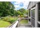 Charming backyard deck with access to an established vegetable garden and pergola at 2260 Falkirk Pointe Dr, Marietta, GA 30062