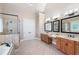 Luxurious bathroom features double vanities, a soaking tub, and a separate glass-enclosed shower at 2260 Falkirk Pointe Dr, Marietta, GA 30062