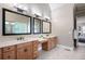 Bright bathroom offers double sink vanities, large mirrors, and plenty of counter space at 2260 Falkirk Pointe Dr, Marietta, GA 30062
