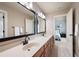 Well-appointed bathroom featuring a double sink vanity with granite countertops and wood cabinetry at 2260 Falkirk Pointe Dr, Marietta, GA 30062