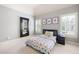 Bright bedroom with a full-length mirror, decorative art prints, and a comfortable patterned bed at 2260 Falkirk Pointe Dr, Marietta, GA 30062