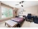 Bedroom features neutral colors, a ceiling fan, and a window with shutters at 2260 Falkirk Pointe Dr, Marietta, GA 30062