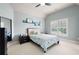 Bright bedroom with a ceiling fan, carpet, and window with shutters at 2260 Falkirk Pointe Dr, Marietta, GA 30062