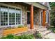 Inviting stone porch with wooden columns and a decorative flower box, adding to the home's curb appeal at 2260 Falkirk Pointe Dr, Marietta, GA 30062