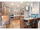 Gourmet kitchen features custom cabinetry, granite countertops, stainless steel appliances, and a breakfast bar at 2260 Falkirk Pointe Dr, Marietta, GA 30062