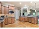 Well-equipped kitchen showcases granite countertops, stainless steel appliances, and plenty of storage space for culinary enthusiasts at 2260 Falkirk Pointe Dr, Marietta, GA 30062