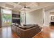 Spacious living room features hardwood floors, fireplace, ceiling fan, and large windows that let in an abundance of natural light at 2260 Falkirk Pointe Dr, Marietta, GA 30062