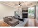 Cozy living room with a fireplace, coffered ceiling, and large windows providing plenty of natural light at 2260 Falkirk Pointe Dr, Marietta, GA 30062
