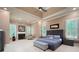 Spacious primary bedroom boasts tray ceilings, a fireplace, and large windows at 2260 Falkirk Pointe Dr, Marietta, GA 30062