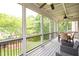 Beautiful screened porch featuring an outdoor dining area and wooded views at 2260 Falkirk Pointe Dr, Marietta, GA 30062