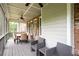 The cozy screened porch features an outdoor seating area and access to a brick patio at 2260 Falkirk Pointe Dr, Marietta, GA 30062