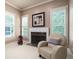 Comfortable sitting area features a fireplace, chair, and shuttered windows at 2260 Falkirk Pointe Dr, Marietta, GA 30062