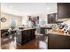 Spacious kitchen features a central island, wooden floors and dark cabinets at 3621 Guinevere Trce, Douglasville, GA 30135