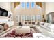 Bright living room featuring high ceilings, large windows, and a comfortable seating area at 3621 Guinevere Trce, Douglasville, GA 30135