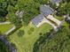 Beautiful aerial view of home featuring lush green landscaping and mature trees at 401 Cottonwood Dr, Woodstock, GA 30189