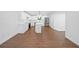 Open concept kitchen featuring stainless steel appliances and a central island at 401 Cottonwood Dr, Woodstock, GA 30189
