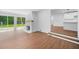 Bright living room with brick fireplace and sliding glass doors leading to the backyard at 401 Cottonwood Dr, Woodstock, GA 30189