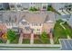 An aerial view of townhomes showcasing their layout and well-maintained landscaping at 4405 Donahue Ave, Sugar Hill, GA 30518