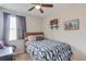 Bedroom with window, neutral walls, and coastal-themed decor at 4405 Donahue Ave, Sugar Hill, GA 30518