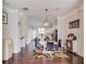 Elegant dining room featuring modern lighting, hardwood floors, and stylish decor at 4405 Donahue Ave, Sugar Hill, GA 30518